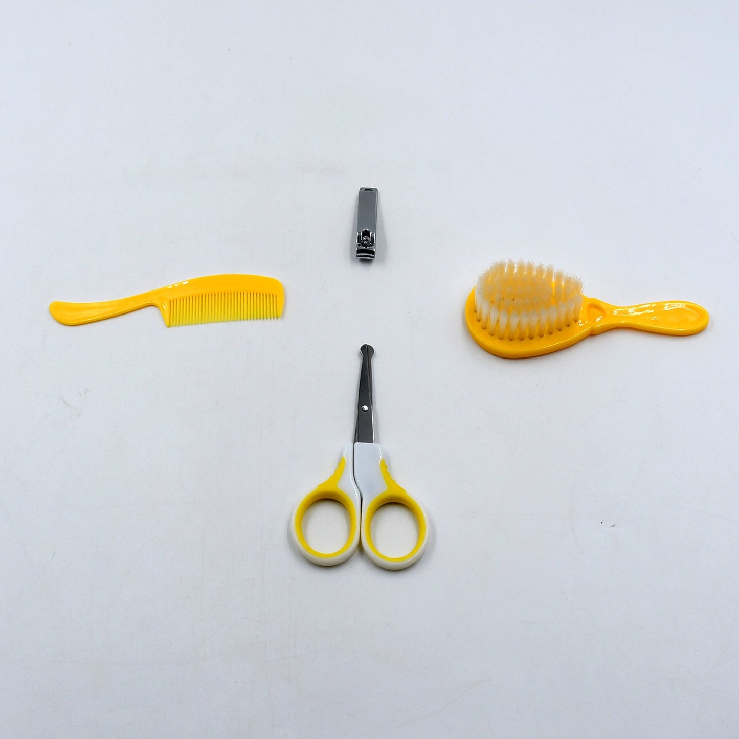 Complete baby care kit with nail clipper, comb, brush, and scissors for safety and grooming.