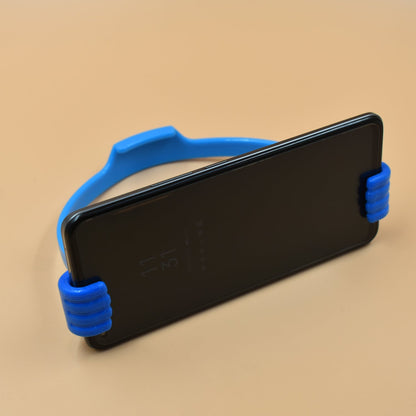 Mobile phone holder with hand shape, useful in home and office spaces.